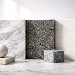 Muestras de piedra: mármol veteado, granito oscuro y piedra clara. Observa la diferencia entre granito y mármol en sus texturas.